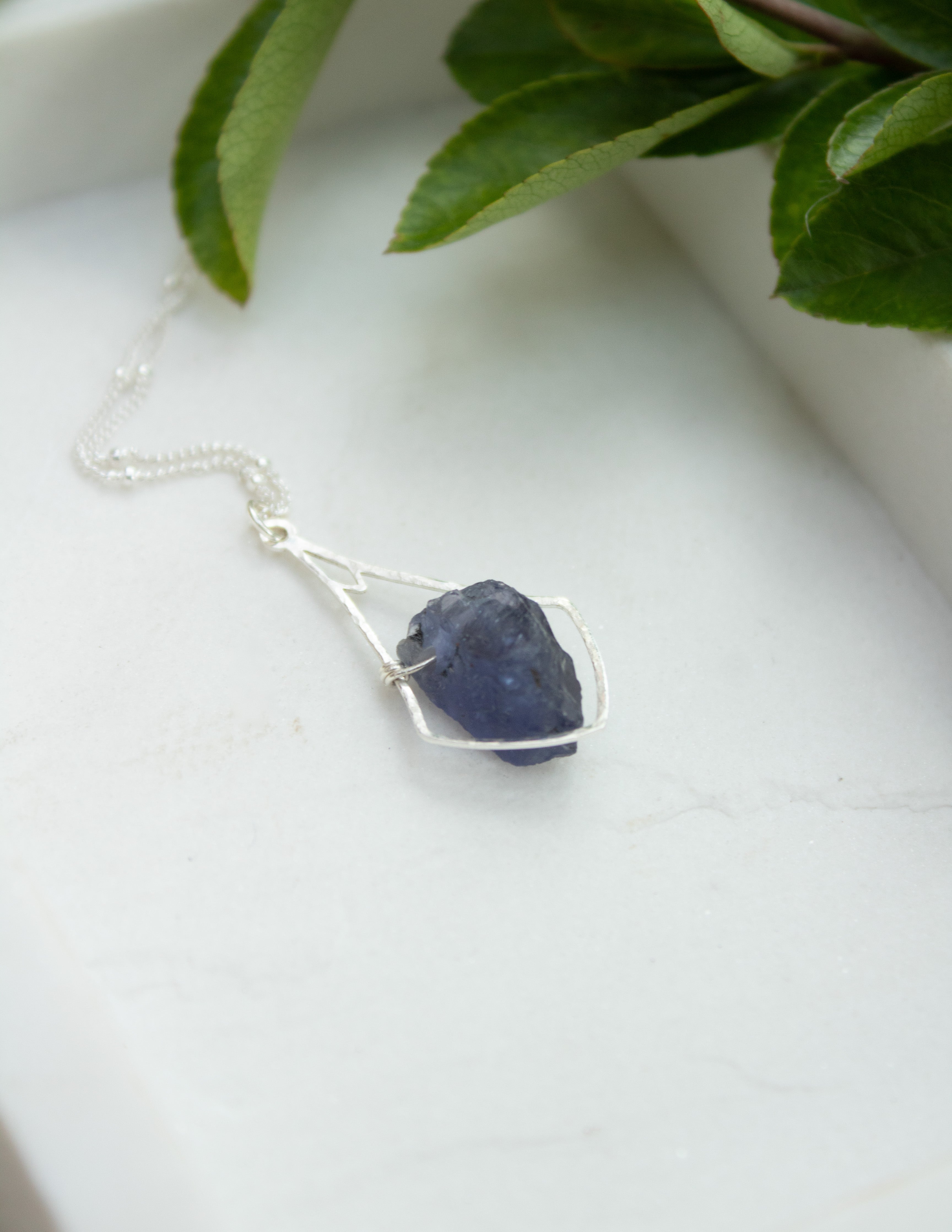 Iolite crystal hammered bell pendant