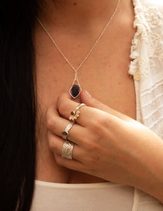 Iolite crystal hammered bell pendant