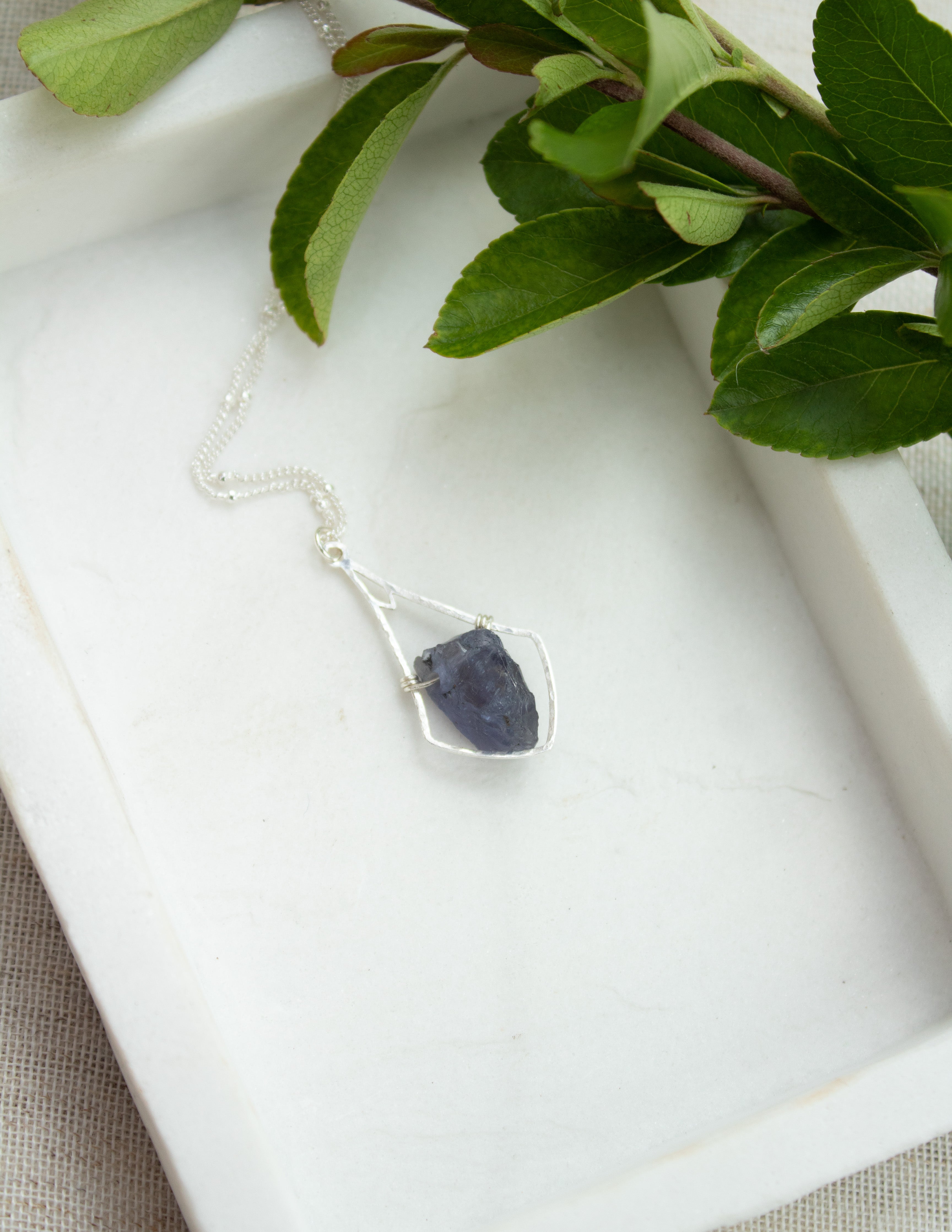 Iolite crystal hammered bell pendant